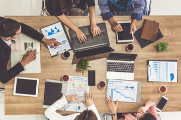 Top view of businessman executive in group meeting with other businessmen and businesswomen in...