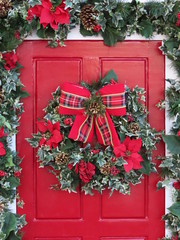 Ornate door for christmas. Bows, garland and more Christmas items