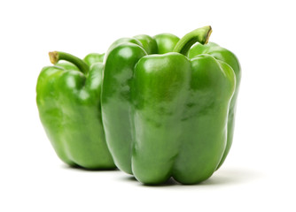 fresh green bell pepper (capsicum) on a white background