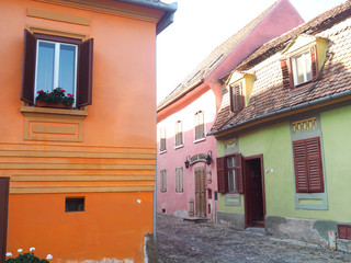 Colorful retro buildings in city center of Sighisoara, Romania
