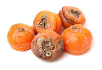 rotten persimmon fruits isolated on white background