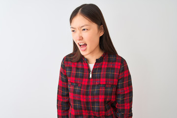 Young chinese woman wearing casual jacket standing over isolated white background angry and mad...