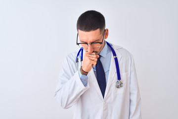 Fototapeta premium Young doctor man wearing stethoscope over isolated background feeling unwell and coughing as symptom for cold or bronchitis. Healthcare concept.