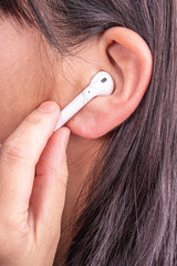 Fototapeta premium Female wearing earphones headphones