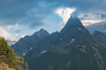 Panorama of mountains and forest scene in national park of Dombay, Russia
