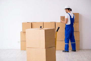 Young male professional mover doing home relocation