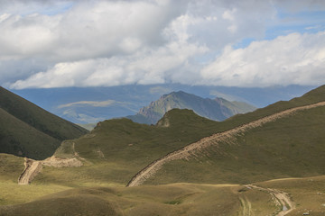 Panorama of road in mountains of national park Dombay, Caucasus