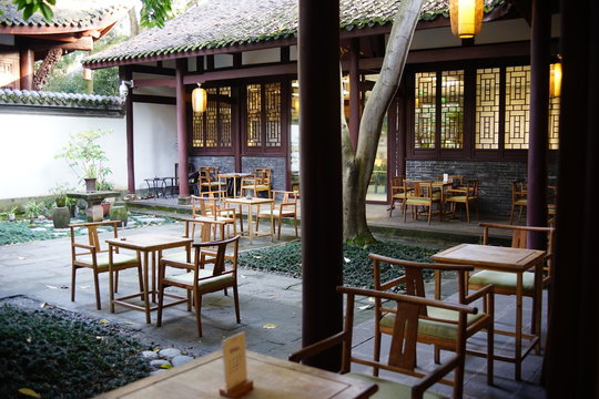 Traditional Setting Of An Outdoor Oriental Tea House With Wooden Table And Chair At Chengdu, China. 