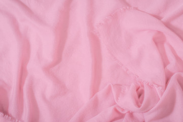 Pink Scarf fabric texture. Winter concept. Flat lay, top view, copy space