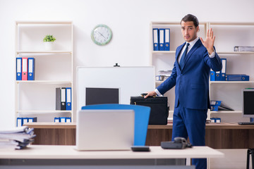 Young male businessman working in the office