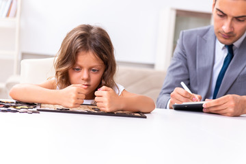 Child psychologist attending small girl