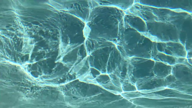 Abstract pattern created from wind on the surface of a pool