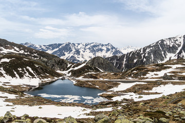 Alpine lake in the Gotthard pass the swiss alps between the Canton of Ticino and Uri in Switzerland