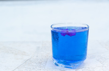 Butterfly pea water on white table and copy space