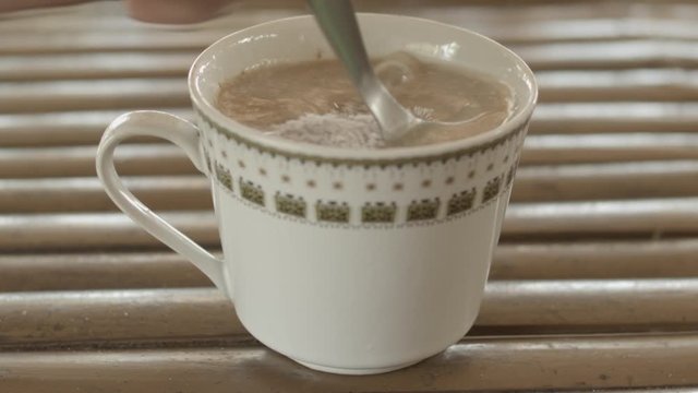 Close Up Shot Of Mixing An Instant Coffee