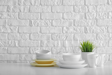 Set of clean dishware on table