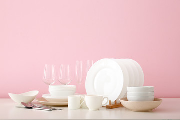 Set of clean dishware on table
