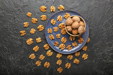 Obraz na płótnie Canvas Composition with tasty walnuts on dark background