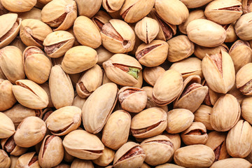 Tasty pistachio nuts as background