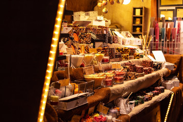market stall showing an assortment of handmade candles from spices at traditional famous christmas...
