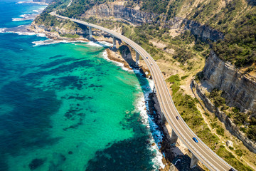 Aerial view of the iconic Sea Cliff Bridge along the beautiful coast in the northern Illawarra region of New South Wales, Australia    
