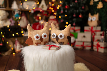 Christmas scene with beautiful bokeh in the background and plush owls