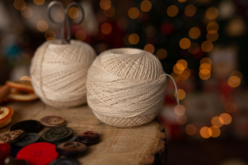 A Christmas scene with beautiful bokeh in the background and sewing tools