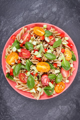 Salad with wholegrain pasta and vegetables as healthy meal containing vitamins and minerals