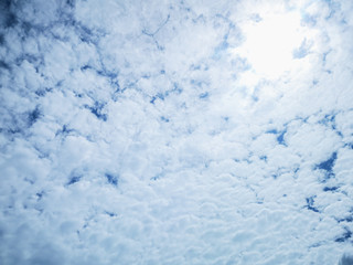 Cloudscape with fluffy white clouds blue sky  and sunlight abstract nature background.