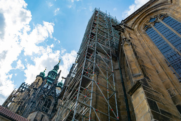 Ancient historical monument - Prague Castle, during reconstruction surrounded by scaffolding