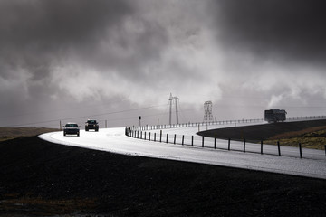 Fototapeta premium A car on road in rainy day, Iceland