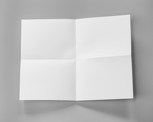 Poster mock-ups paper, white paper isolated on gray background with copy space for text,  Blank portrait A4. brochure magazine isolated, can use banners products business cards to showcase your.