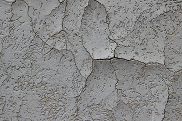 Heavily cracked stucco that has begun to delaminate from its substrate 