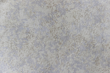 Texture of a concrete wall with decorative plasterwork of several colors 