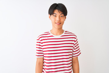 Young chinese man wearing casual striped t-shirt standing over isolated white background with a happy and cool smile on face. Lucky person.