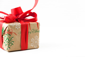 Top view of Christmas present/gift on white wooden background with copy space.