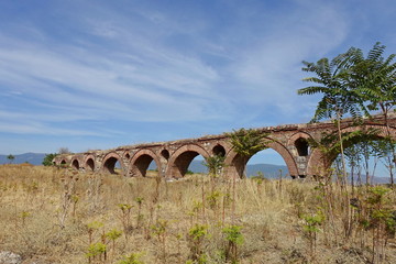 Fototapeta na wymiar Roman aqueduct in the village of Vizbegovo near the capital of Northern Macedonia Skopje