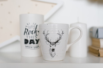 White Christmas mugs on the shelf