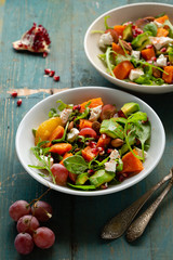 Salad with pumpkin and feta close-up
