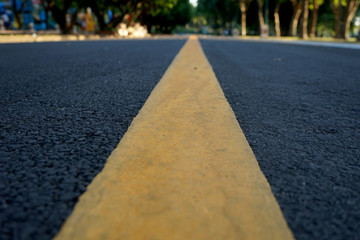 Obraz premium Road traffic paint Yellow on the asphalt surface