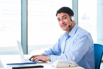 Obraz na płótnie Canvas Male call-center operator in business concept