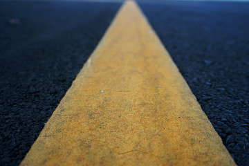 Road traffic paint Yellow on the asphalt surface