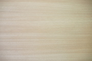 Closeup of glossy wooden wall in light brown and golden tone for interior and warm luxury background. Cool banner on page, cover, website and presentation