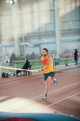 Obraz premium Pole vaulting in the sports stadium - a sportive man running on the track