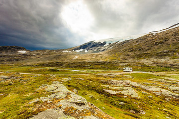 Fototapeta premium Camper car in norwegian mountains