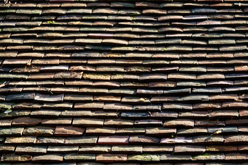 Shingles on an old roof are slate