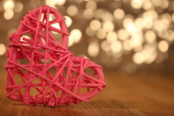beautiful pink heart rattan heart on shiny background