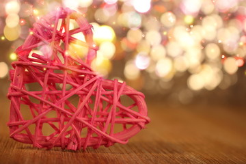 beautiful pink heart rattan heart on shiny background