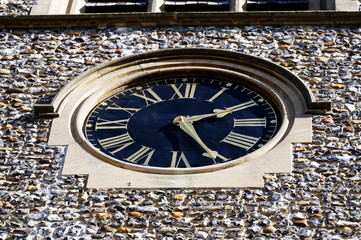 A large outside clock shows the time at twenty-five past two