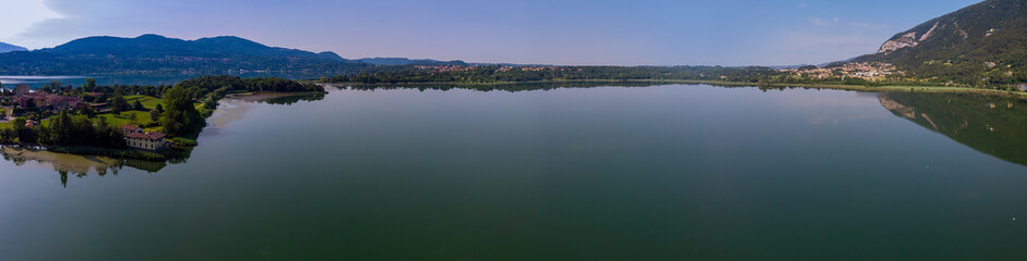 Fototapeta na wymiar Lago di Pusiano panorama view of drone - reflections in the lake